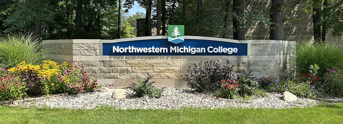 NMC letters with wave pattern