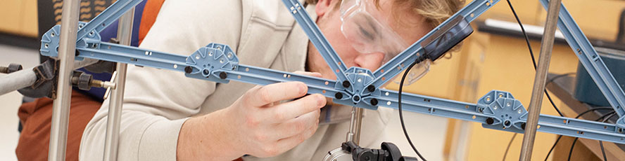 An NMC Engineering program student works on a model in an engineering class