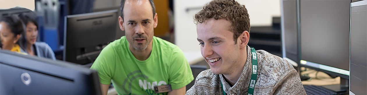 An NMC advisor helps a student with registration