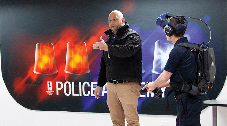 An NMC Police Academy instructor and student demonstrate the use of VR goggles during a training exercise