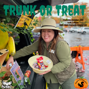 Trunk or Treat 2024 image of trick or treater holding a bowl of candy