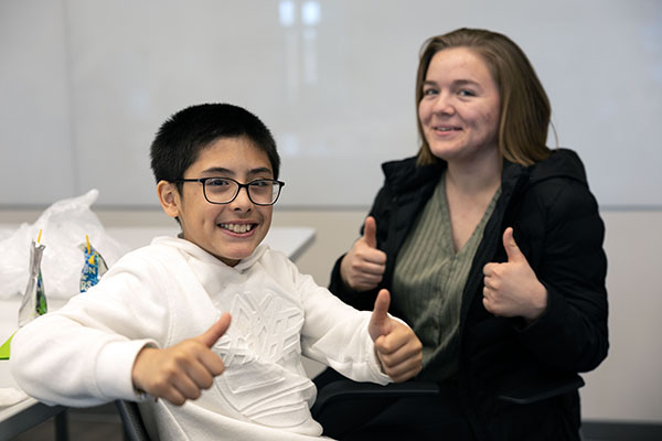 A Blair Elementary student and mentor give thumbs-up.jpg